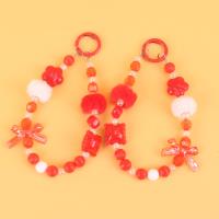 TL红色蝴蝶结毛球手机链